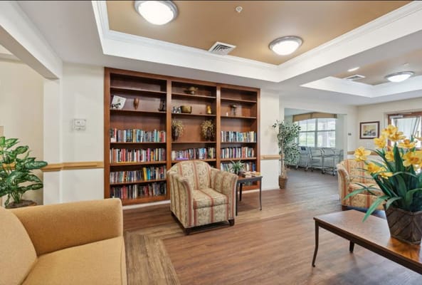 Bright common area with seating and bookshelves