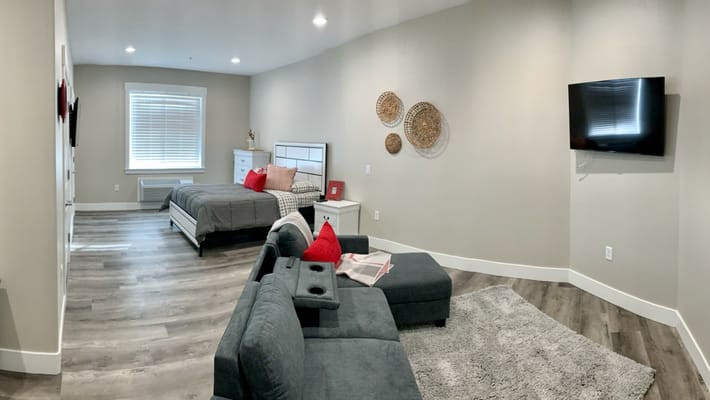 A view of a private resident room with modern decor