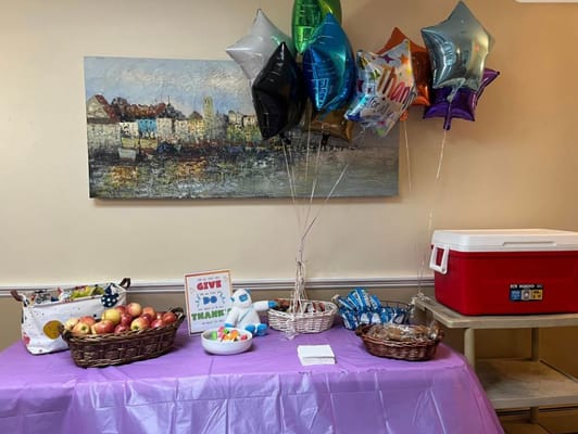 Decorated table with snacks and balloons for an event