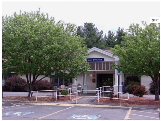 Exterior view of the main entrance with trees