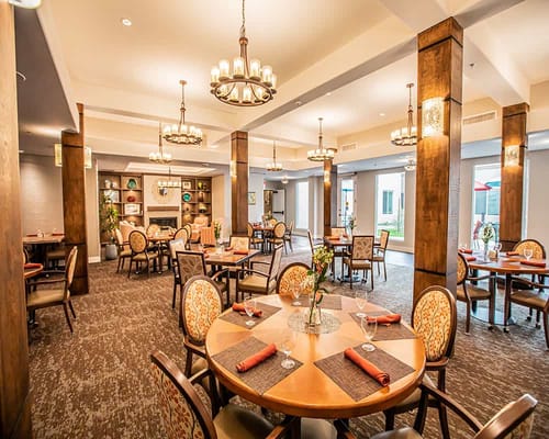 Dining room with tables set for residents