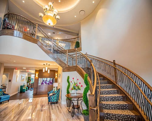 Elegant interior staircase in a senior living facility