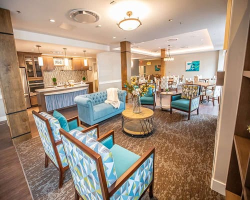 Common area with seating and kitchen in the background