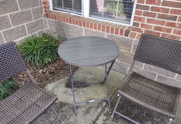 Outdoor seating area with a table and chairs