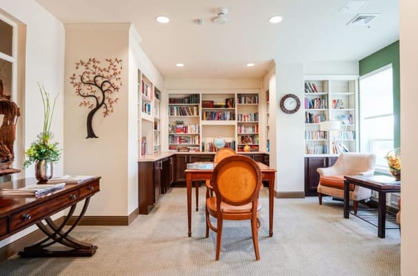 Cozy reading area with bookshelves and seating