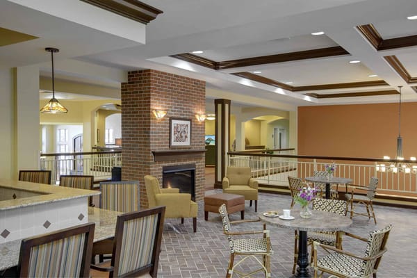 A comfortable lobby with seating and a fireplace at Farmington Station.
