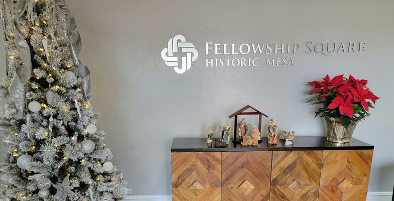 Decorated lobby with a Christmas tree and nativity scene