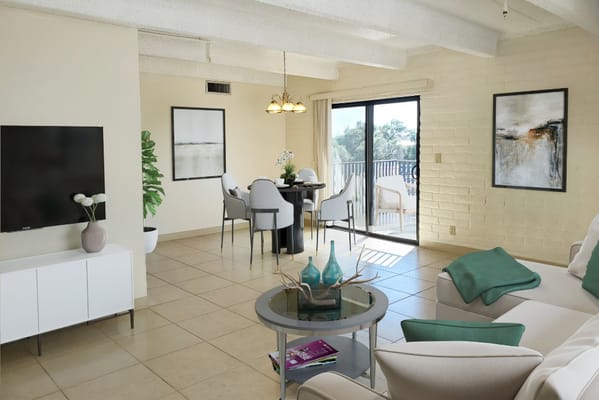 Bright and inviting common area with seating and dining space