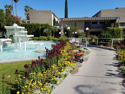 Beautiful garden and fountain area at the facility
