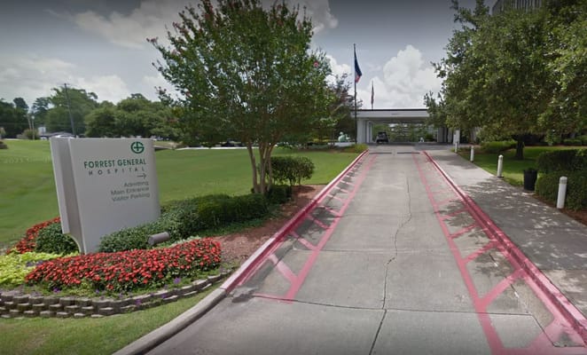 Entrance view of Forrest General Hospital with landscaped area