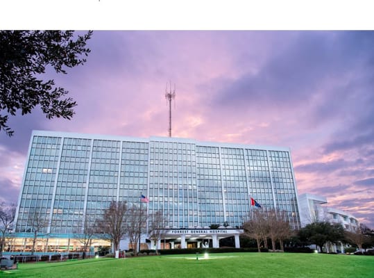 Exterior view of Forrest General Hospital at sunset