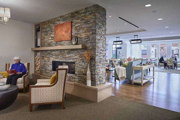 Residents enjoying a cozy common area in the facility.