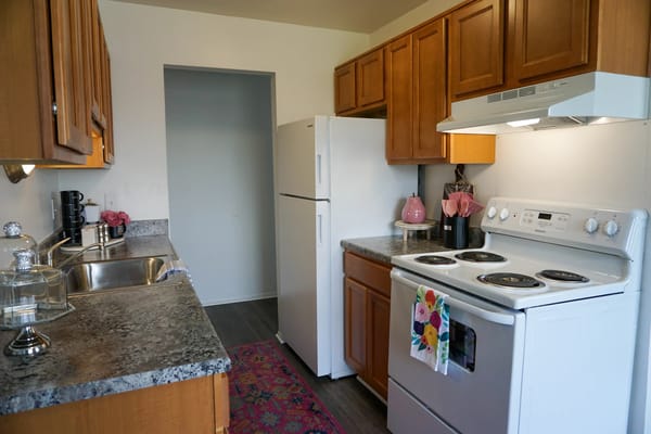 Modern kitchen with wooden cabinets and stainless steel appliances