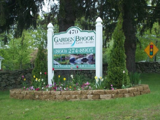 Signage for Garden Brook Residential Care Home with flowers