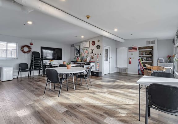 Bright common area with tables and chairs