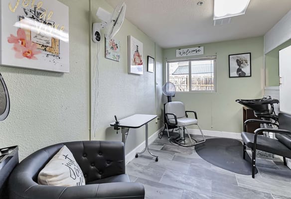 Interior view of a salon area with hair styling chairs