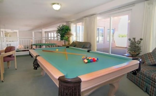Billiards table with colorful balls in a lounge area