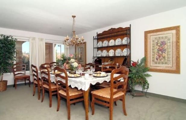Dining room with a large table set for a meal