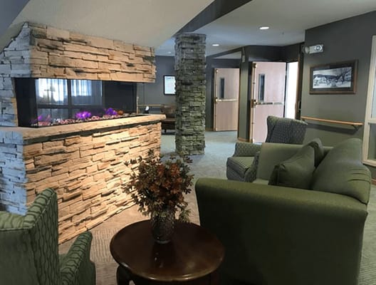 Common area with seating and fireplace