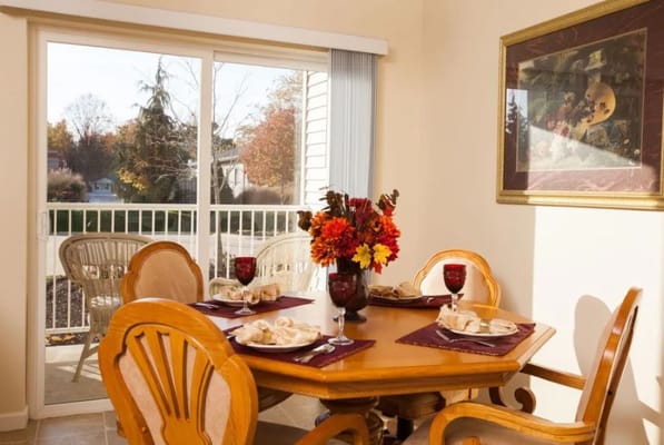 Dining area set with food and flowers