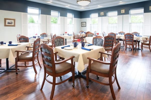 Dining room setup with tables and chairs