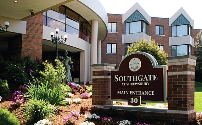 Main entrance sign and landscaping at Hampton Suites at Shrewsbury