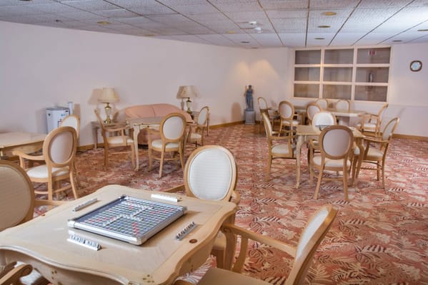 Interior view of the game room with tables and chairs