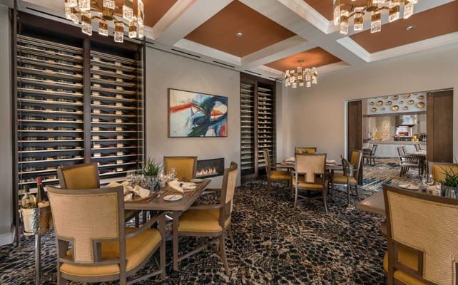 Elegant dining room with wine display and tables