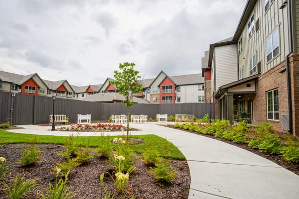Outdoor garden area with seating and pathways