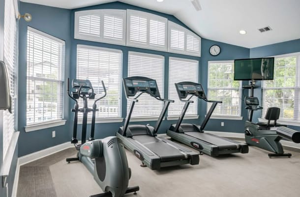 Interior view of a fitness area with treadmills