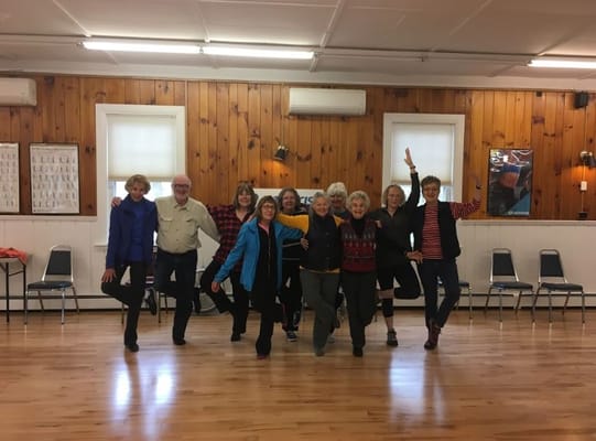 Residents participating in a dance activity in the common area