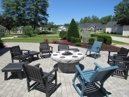 Outdoor gathering area with chairs and fire pit