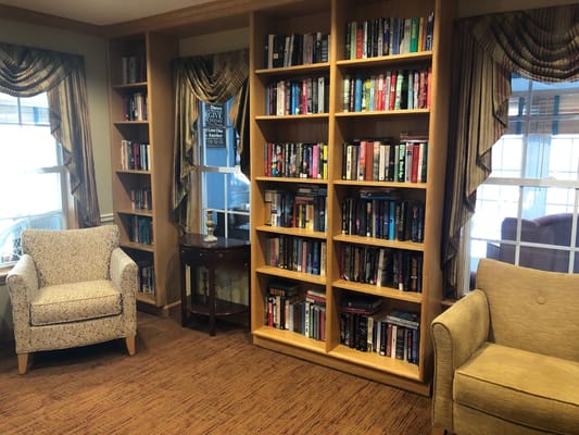 Comfortable seating and bookshelves in a reading area