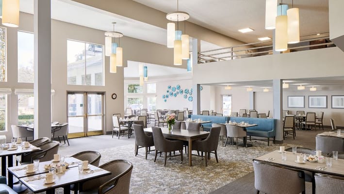 Bright dining area with tables set for meals