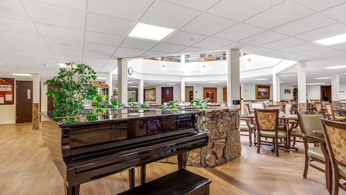 Interior view of a dining area with a piano