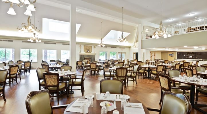 Bright dining area with tables set for meal service