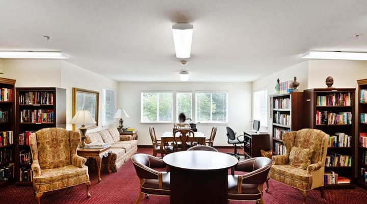 Bright common area with bookshelves and seating