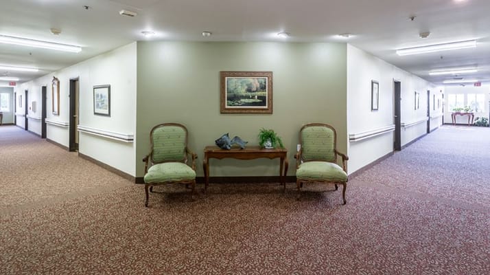 Interior hallway with seating and artwork