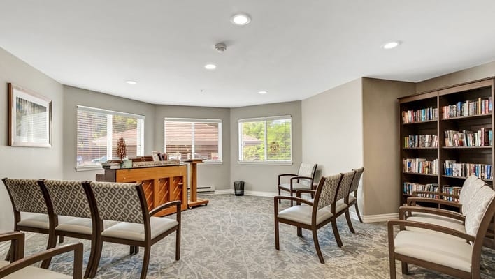 Bright common area with seating and bookshelves
