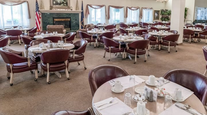 Dining room setup with tables and chairs