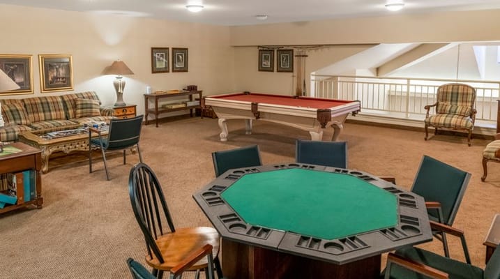 Interior common area with a pool table and seating