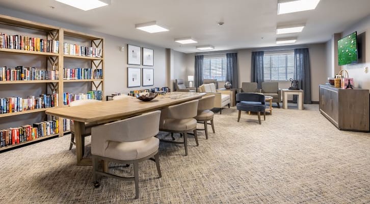 Bright common area with bookshelves and seating