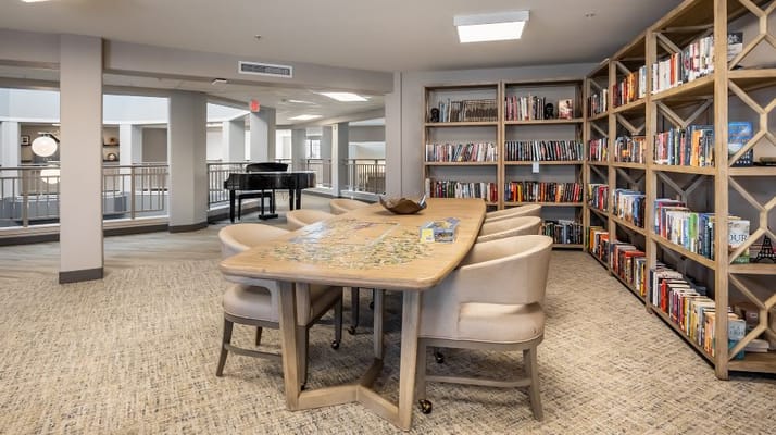 Interior common area with bookshelves and seating