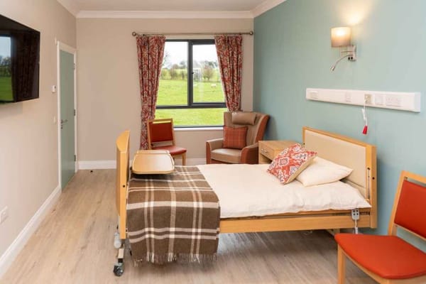 A well-furnished private resident room with a view