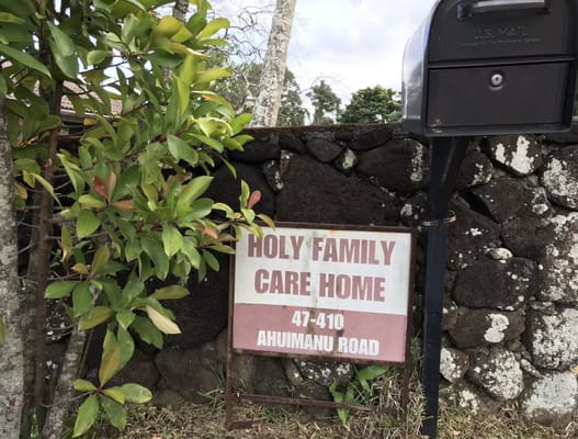 Sign for Holy Family Care Home at the entrance