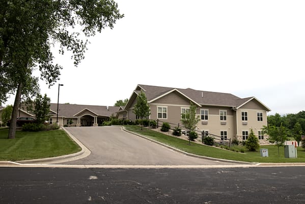 Exterior view of the assisted living facility with landscaped surroundings