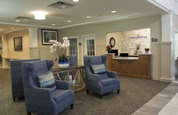 Bright lobby area with comfortable seating and reception desk