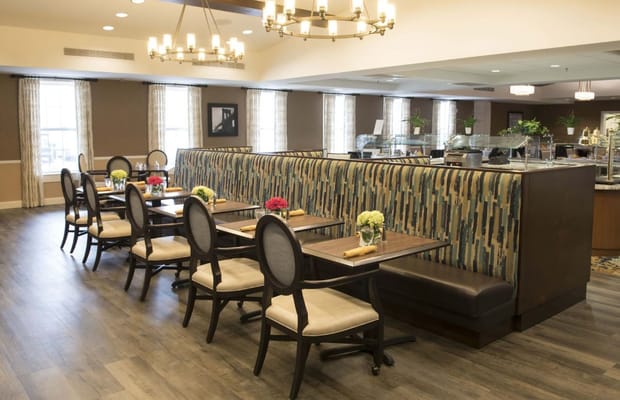Dining area with tables and decorative flowers