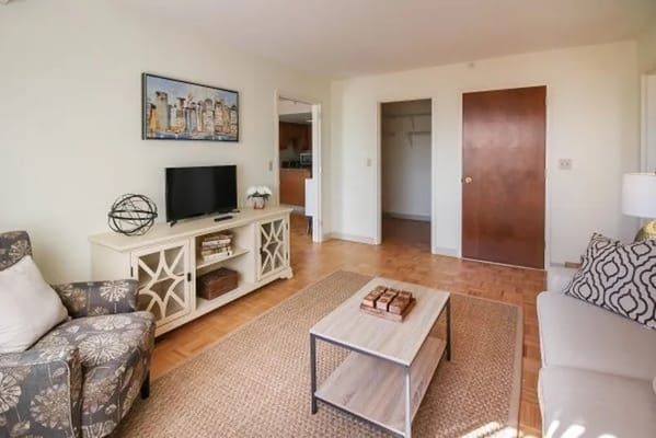 Living room with a comfortable seating area and TV.