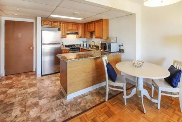 Cozy kitchen and dining area with wooden cabinets